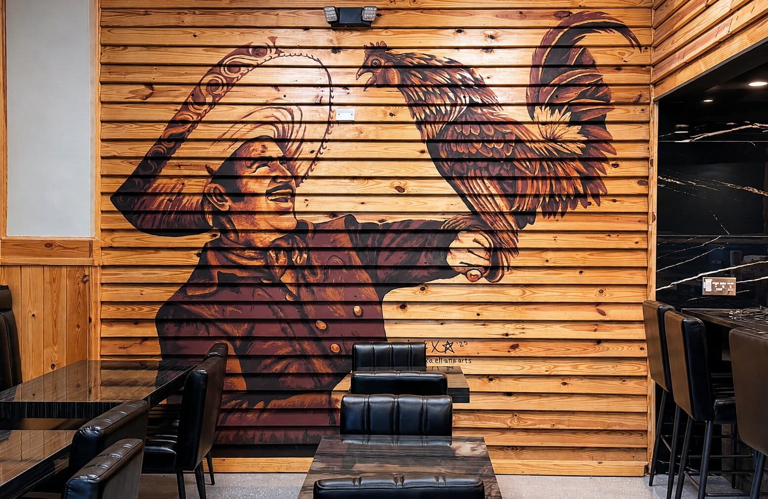 Charro and rooster mural at El Meson Mexican Bar and Grill